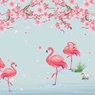 Pink flamingos beneath falling cherry blossoms with tropical plants against light gray background - view 8 - final