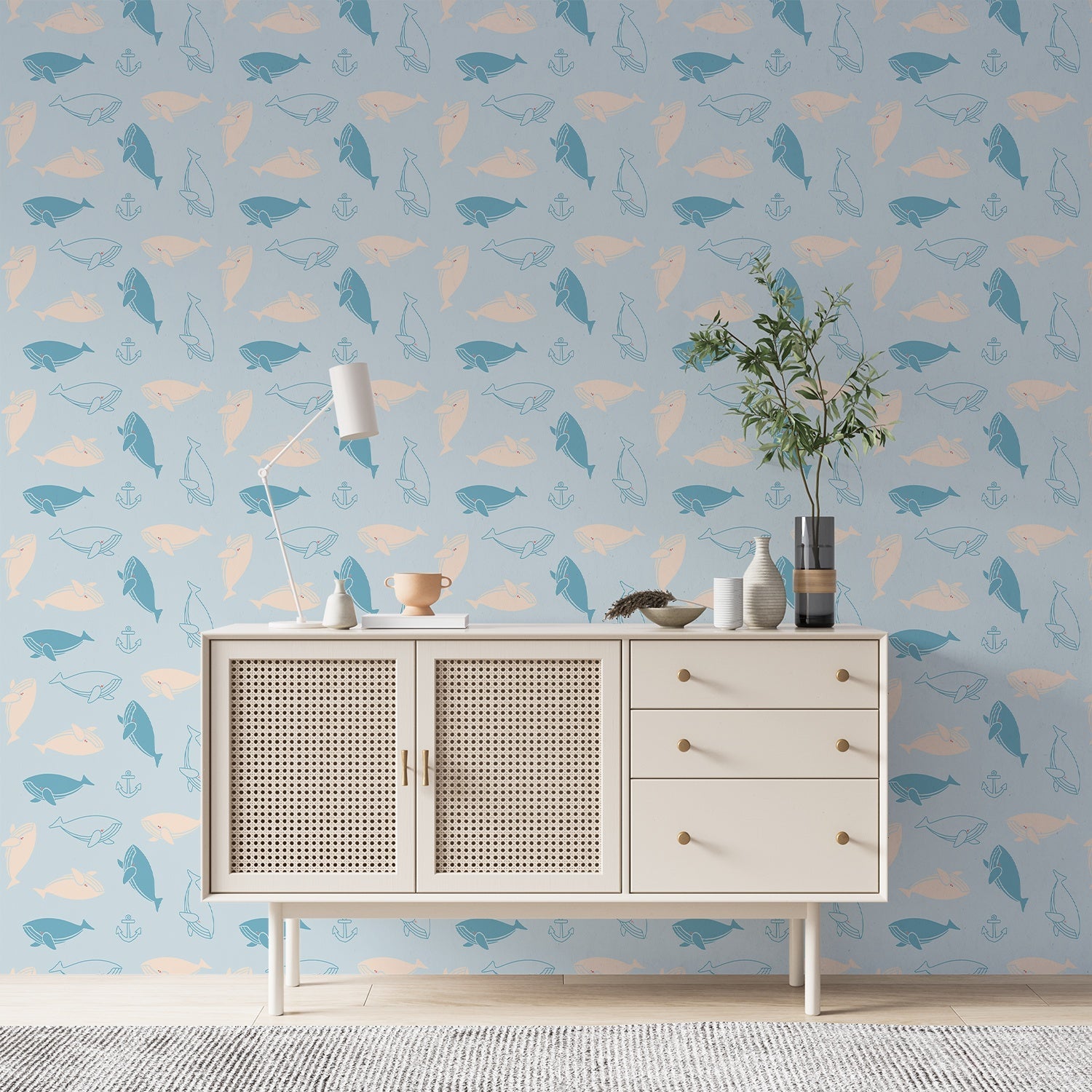 Repeating whale silhouettes in soft blue and peach tones create whimsical nautical pattern - final foyer