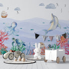 Whimsical underwater scene with dolphin, octopus, turtle and coral against soft blue waves - final kids-room