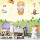 Cartoon animals in hot air balloons and aircraft over green hills with playful scenery - final kids-room